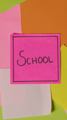 Vertical-Video-Education-Concept-Of-Revolving-Sticky-Notes-With-School-Written-On-Top-Note